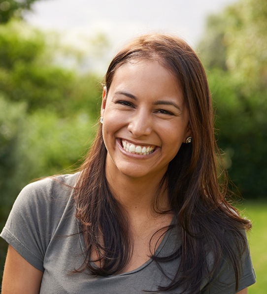 Portrait of happy, smiling woman in outdoor setting